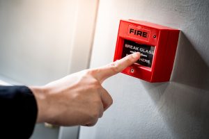 What are some common causes of false alarms in fire alarm systems?