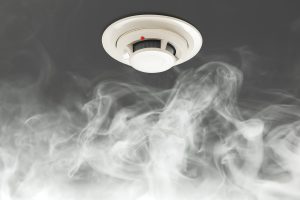 What is the difference between conventional and addressable fire alarm systems?